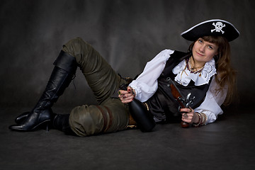 Image showing Girl - pirate with pistol and bottle