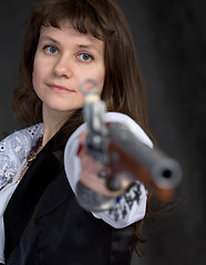 Image showing The girl - pirate with ancient pistol in hand