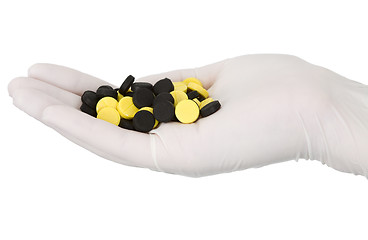 Image showing Tablets on hand in glove