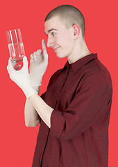 Image showing Boy hold glass of water