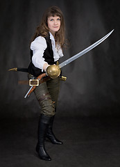 Image showing The girl - pirate with a sabre in hands