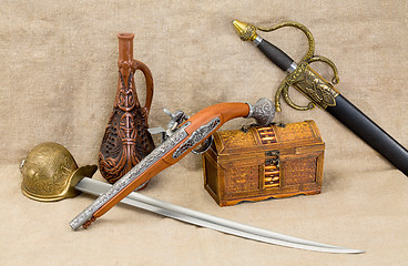 Image showing Bottle, rapier, sword, pistol and chest