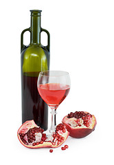 Image showing Glass of wine, bottle and a red pomegranate