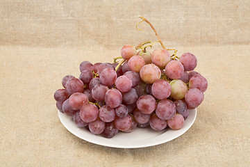 Image showing Grape on plate on textile background