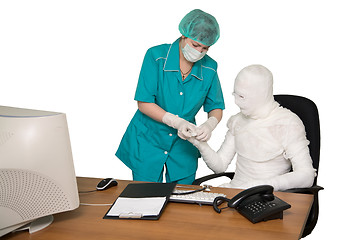 Image showing The bandaged boss and nurse