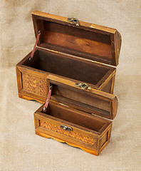 Image showing Two wooden opening ancient chest