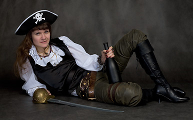 Image showing Girl - pirate with rapier and bottle