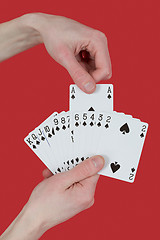 Image showing Playing cards on hands