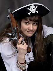 Image showing Girl - pirate with pistol in hand