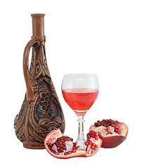 Image showing Glass of wine, bottle and a red pomegranate