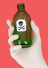 Image showing Green bottle with skull and crossbones