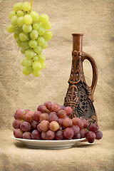 Image showing Grapes and wine in bottle