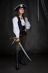 Image showing The girl - pirate with a sabre in hands