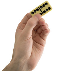 Image showing Bone dominoes on hand