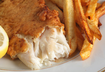 Image showing Fish and chips with lemon