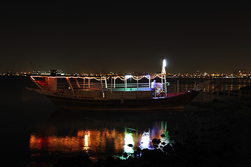 Image showing Dhow at night and reflection