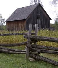 Image showing Fence post and Barn