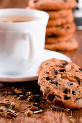 Image showing cup of herbal tea and some fresh cookies