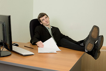 Image showing Boss in black suit on a workplace