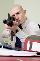 Image showing Accountant armed with a rifle