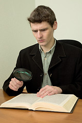 Image showing Man read book on a workplace