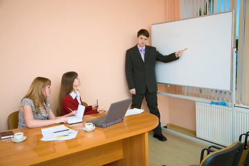 Image showing Young man to speak at a meeting