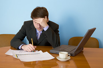 Image showing Businessman on a workplace with the laptop