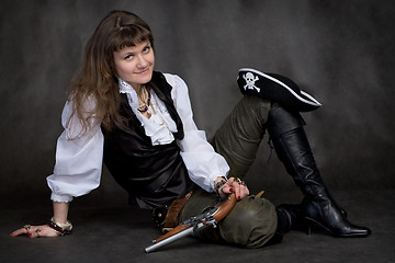 Image showing Girl with pistol and pirate hat