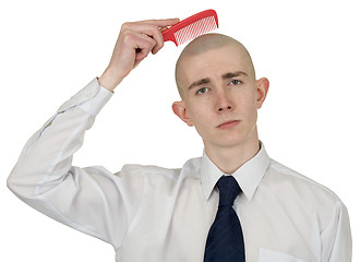Image showing Absolutely bald guy with a hairbrush