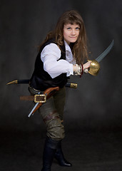 Image showing The girl - pirate with a sabre in hands