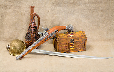 Image showing Bottle, rapier, sword, pistol and chest