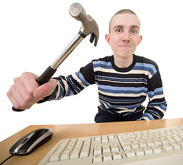 Image showing Young man with hammer on hand and keyboard