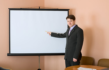 Image showing Businessman near the white screen