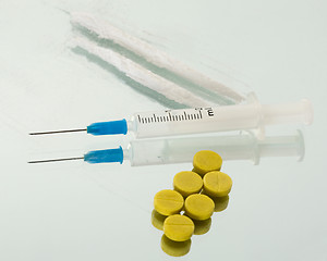Image showing Syringe, tablet and powder of drug