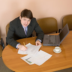 Image showing Businessman on a workplace with the laptop