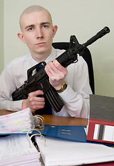 Image showing Accountant armed with a rifle