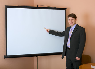 Image showing Businessman near the white screen