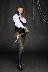 Image showing The girl - pirate with a sabre in hands