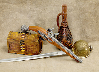 Image showing Bottle, rapier, sword, pistol and chest