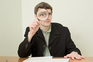 Image showing Clerk at office with magnifier