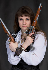 Image showing Girl - pirate with two ancient pistols in hands