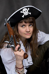 Image showing Girl - pirate with pistol in hand