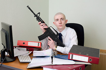 Image showing Accountant armed with a rifle