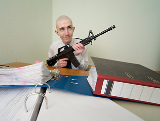 Image showing Accountant armed with a rifle