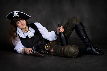 Image showing Girl - pirate with pistol and bottle