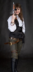 Image showing Girl - pirate with pistol in hand and eye patch