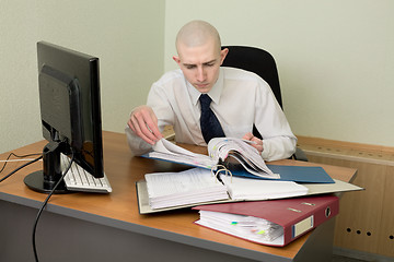 Image showing Bookkeeper on a workplace at office