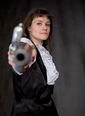 Image showing The girl - pirate with ancient pistol in hand