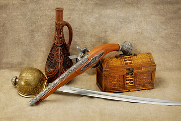 Image showing Bottle, rapier, sword, pistol and chest