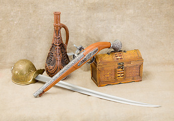 Image showing Bottle, rapier, sword, pistol and chest